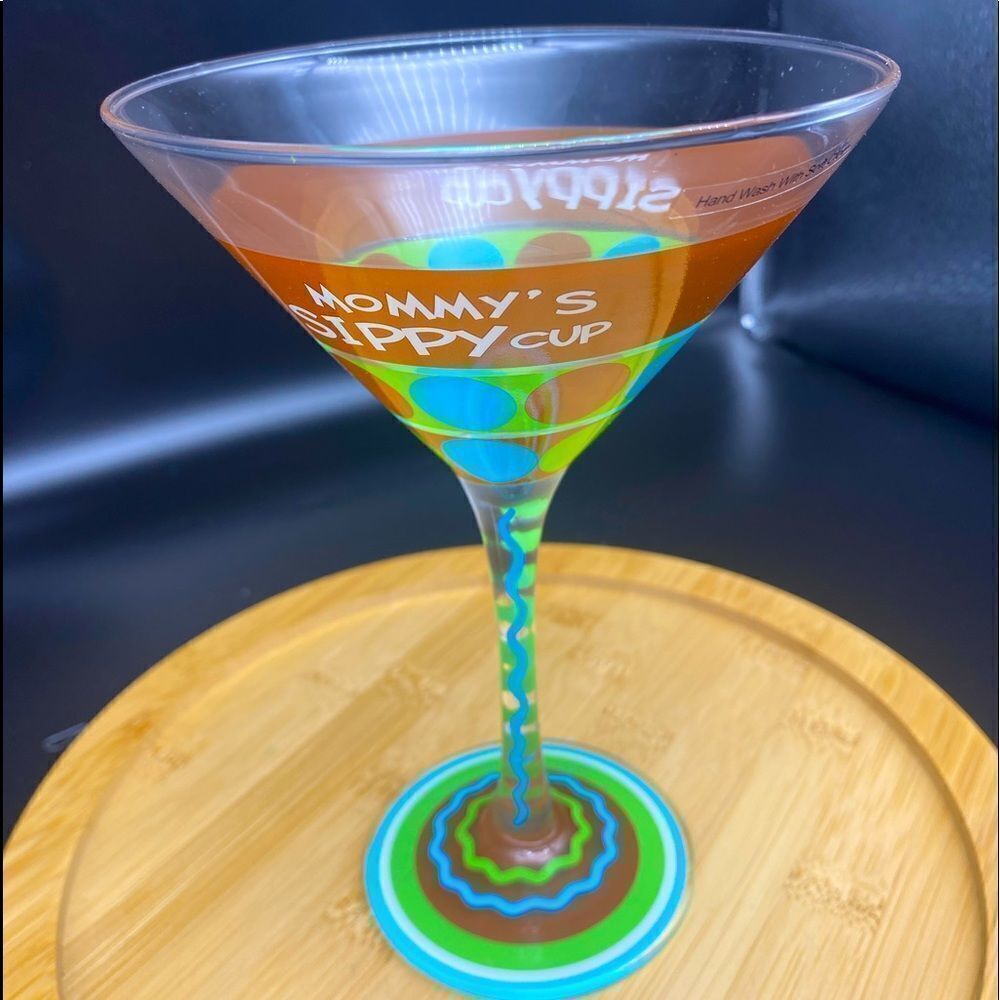 A margarita or martini stemmed glass painted with “Mommy’s Sippy Cup”
